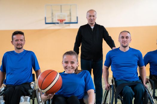  photo of the basketball team of war invalids with professional sports equipment for people with disabilities on the basketball court. High quality photo