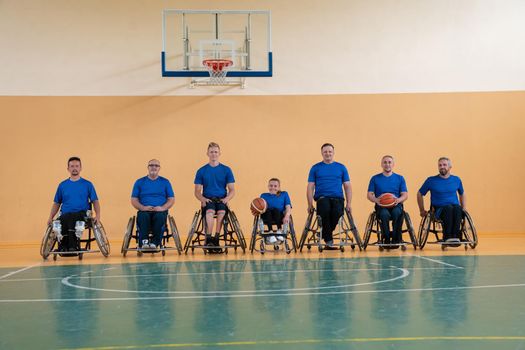  photo of the basketball team of war invalids with professional sports equipment for people with disabilities on the basketball court. High quality photo