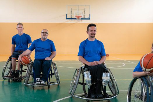  photo of the basketball team of war invalids with professional sports equipment for people with disabilities on the basketball court. High quality photo