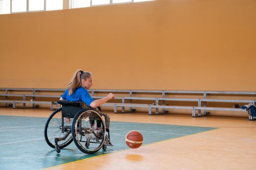  photo of the basketball team of war invalids with professional sports equipment for people with disabilities on the basketball court. High quality photo