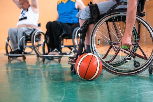 a photo of basketball teams with disabilities with the selector in the big hall before the start of the basketball game. Selective focus 