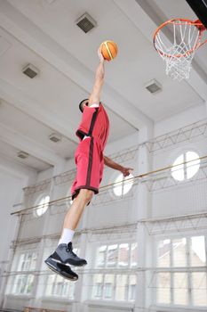 young and healthy people man have recreation and training exercise  while play basketball game at sport gym indoor hall