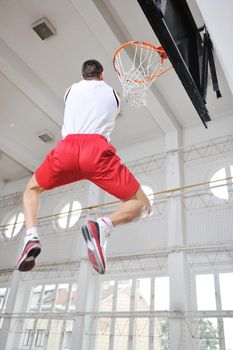 young and healthy people man have recreation and training exercise  while play basketball game at sport gym indoor hall