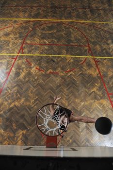 young and healthy people man have recreation and training exercise  while play basketball game at sport gym indoor hall