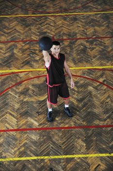 young and healthy people man have recreation and training exercise  while play basketball game at sport gym indoor hall