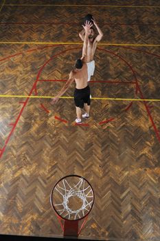 young and healthy people man have recreation and training exercise  while play basketball game at sport gym indoor hall