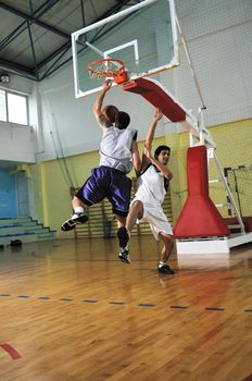 competition cencept with people who playing basketball in school gym