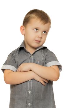 Cute little boy put his hands on his chest and looks away. Close-up - Isolated on white background