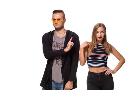 Couple posing, man showing no gesture with index finger, wearing casual clothes isolated on white background with copy text space