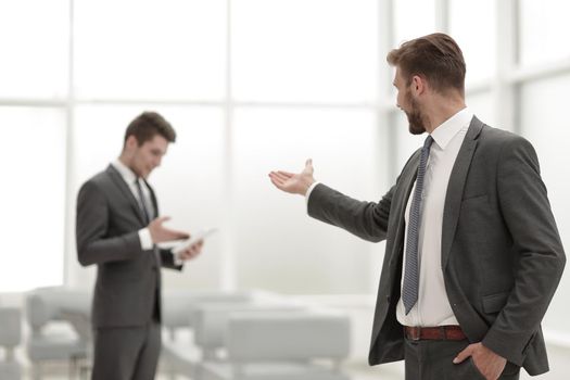 smiling businessman in the background of the office.photo with copy space