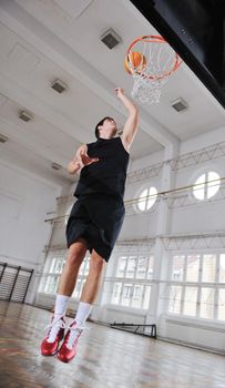 young and healthy people man have recreation and training exercise  while play basketball game at sport gym indoor hall