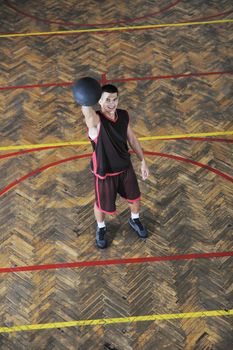 young and healthy people man have recreation and training exercise  while play basketball game at sport gym indoor hall