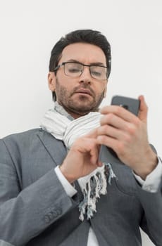 close up. a business man uses his smartphone .photo with copy space