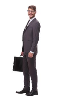in full growth. confident businessman with leather briefcase.isolated on white background
