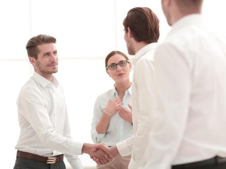 welcome and handshake of business partners.the concept of cooperation
