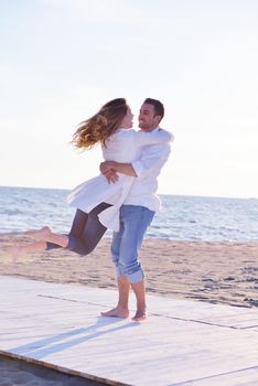 happy young romantic couple in love have fun on beautiful beach at beautiful summer day