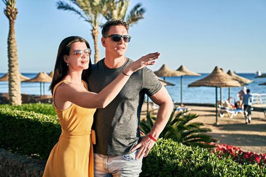 Beautiful caucasian couple on vacation in a tropical resort by the sea