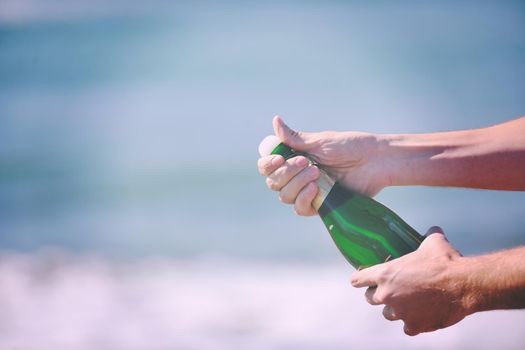 man hands open bottle of champagne alcohol and wine drink outdoor on party celebration event 