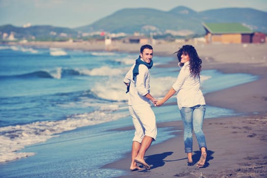 happy young couple in white clothing  have romantic recreation and   fun at beautiful beach on  vacations