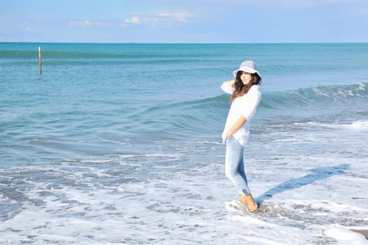 happy young woman relax onbeautiful  beach at morning