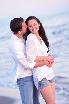 happy young romantic couple in love have fun on beautiful beach at beautiful summer day