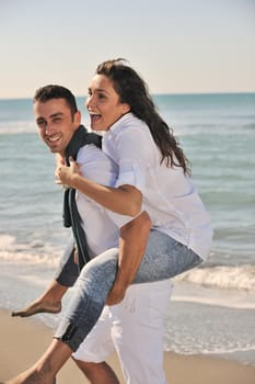 happy young couple in white clothing  have romantic recreation and   fun at beautiful beach on  vacations