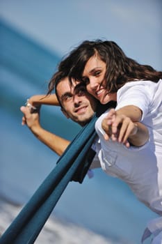 happy young couple in white clothing  have romantic recreation and   fun at beautiful beach on  vacations