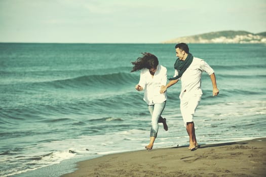 happy young couple in white clothing  have romantic recreation and   fun at beautiful beach on  vacations