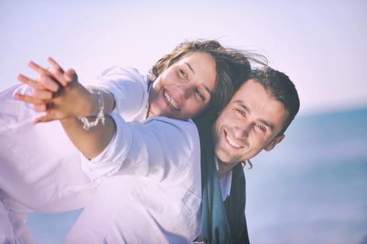 happy young couple in white clothing  have romantic recreation and   fun at beautiful beach on  vacations