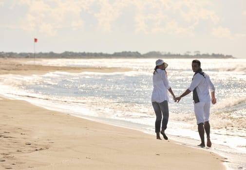 happy young couple in white clothing  have romantic recreation and   fun at beautiful beach on  vacations