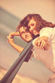 happy young couple in white clothing  have romantic recreation and   fun at beautiful beach on  vacations