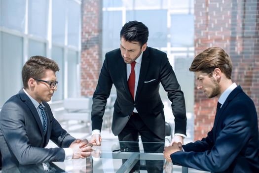 annoyed businessman talking to employees. workers. the concept of labor relations