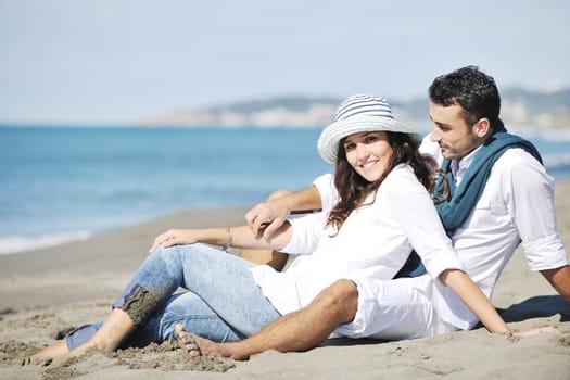 happy young couple in white clothing  have romantic recreation and   fun at beautiful beach on  vacations