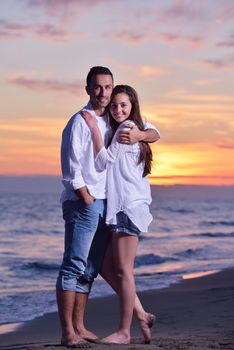 happy young romantic couple in love have fun on beautiful beach at beautiful summer day