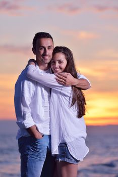 happy young romantic couple in love have fun on beautiful beach at beautiful summer day