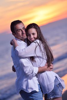 happy young romantic couple in love have fun on beautiful beach at beautiful summer day