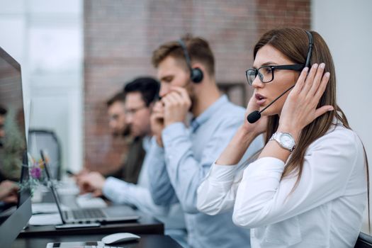 young employee call center talking with the client.photo with copy space