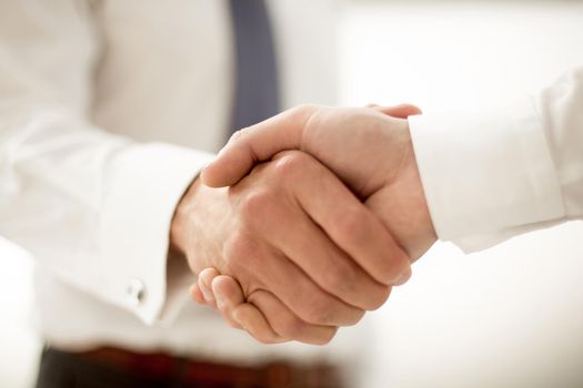 close up.handshake business people. the concept of cooperation