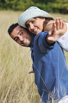 happy young couple have romantic time outdoor while smiling and hug