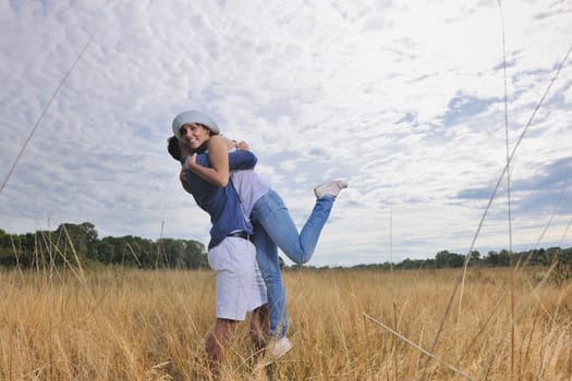 happy young couple have romantic time outdoor while smiling and hug