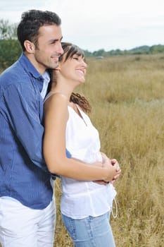 happy young couple have romantic time outdoor while smiling and hug