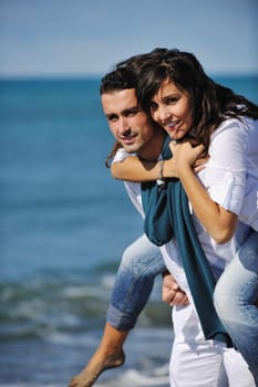 happy young couple in white clothing  have romantic recreation and   fun at beautiful beach on  vacations