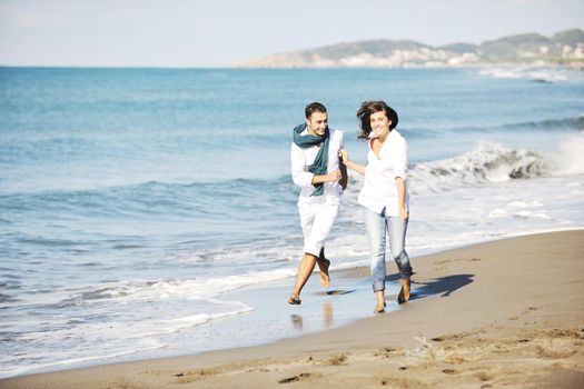 happy young couple in white clothing  have romantic recreation and   fun at beautiful beach on  vacations