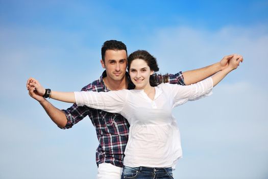 happy young couple have fun and romantic moments on beach at summer season and representing happynes and travel concept