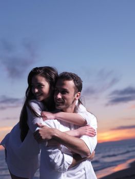 happy young romantic couple in love have fun on beautiful beach at beautiful summer day