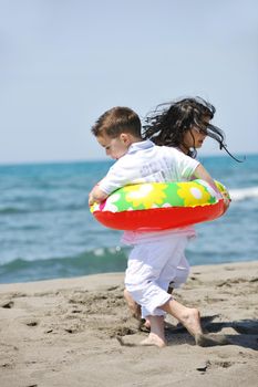 happy young people group have fun  run and jump  on beach beautiful sand  beach