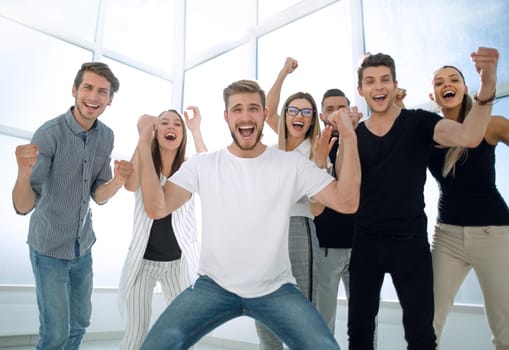 happy team of young employees standing in the office.photo with copy space