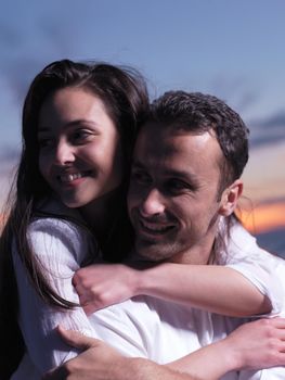 happy young romantic couple in love have fun on beautiful beach at beautiful summer day