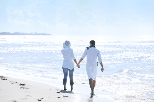 happy young couple in white clothing  have romantic recreation and   fun at beautiful beach on  vacations