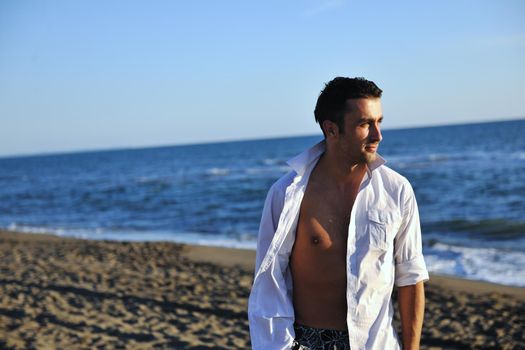 young man have good time and relax at beautifu beach at seaside